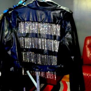 Fashionable black, biker jacket, silver singles on the back